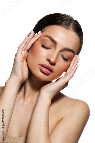Natural beauty concept. Young woman with glowing clean skin smiling at camera on white studio background