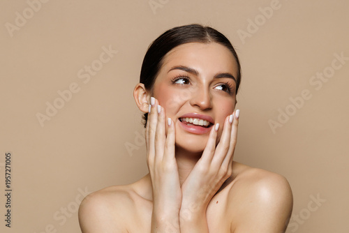 Beautiful woman after spa treatment on beige background, closeup. Space for text