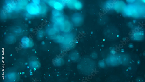 Abstract blue underwater background with soft bokeh, floating particles, and tiny bubbles. Concept for overlay effects, spa and beauty industries, perfumes and cosmetics advertising, holiday, branding