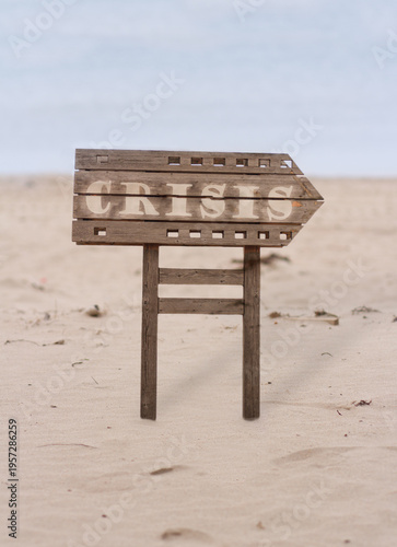 A wooden signpost in the desert, buried in the sand.