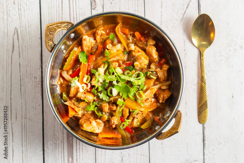 Chicken vegetable bell pepper sauté cooked with spices, garlic, onions, and herbs, colorful, flavorful, and served hot in a savory dish.
