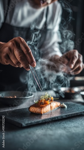 Chef garnishing cooked salmon with tweezers
