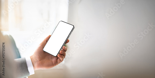 Smartphone in Hand – Panoramic Copy Space Composition, Minimal Background, Blank Screen Mockup