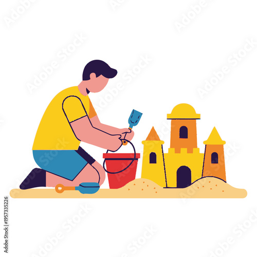 A young boy wearing a yellow t-shirt and blue shorts is happily building a sandcastle on a sunny beach with a red bucket and blue shovel.