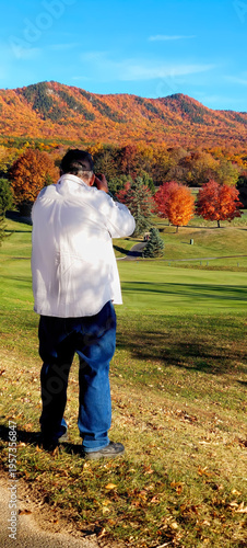  I, as a photographer, know that sometimes you just have to step out of the car and get the photo. Golf course at Massanutten VA Resort with fall colors in the mountain background.