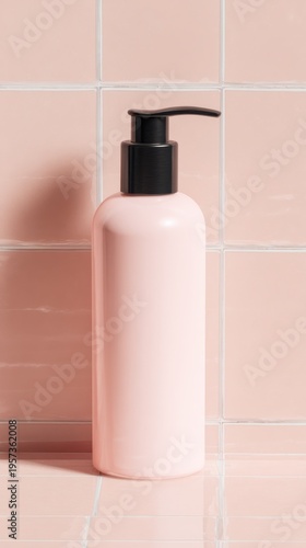 Pink lotion pump bottle with black pump on a tiled surface dispenser cosmetic