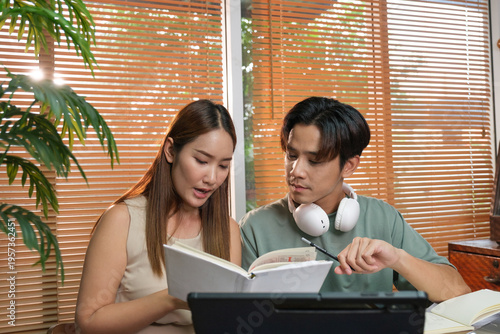 A young Asian couple spend time together at home
