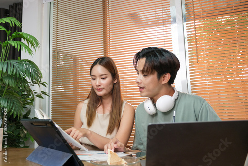 A young Asian couple spend time together at home