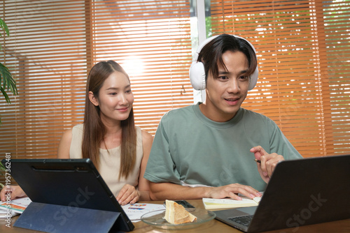 A young Asian couple spend time together at home
