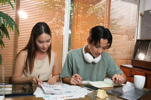 A young Asian couple spend time together at home