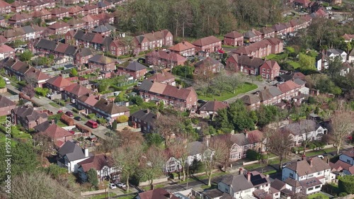 Drone view over suburban semi-detached housing, Wirral, Merseyside,