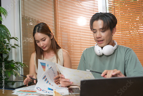 A young Asian couple spend time together at home