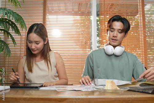 A young Asian couple spend time together at home
