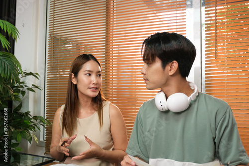 A young Asian couple spend time together at home