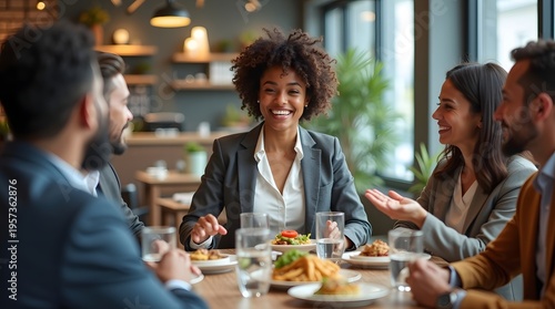 Diverse Group of Professionals Engaging in Friendly Business Meeting over Lunch at Restaurant