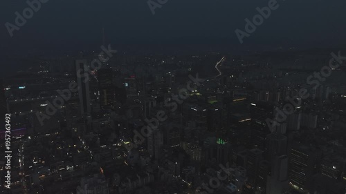 Aerial view of the glowing skyscrapers and busy city lights at night in Teheran-ro, Gangnam, Seoul, South Korea.