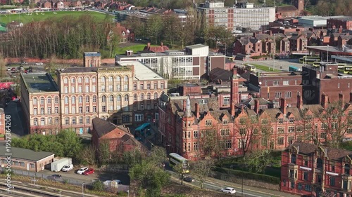 WIGAN, GREATER MANCHESTER, ENGLAND - MARCH 18, 2026: Victorian red brick warehouse buildings in Wigan town centre