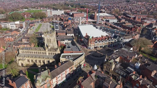 WIGAN, GREATER MANCHESTER, ENGLAND - MARCH 18, 2026: Aerial view of Wigan town centre with the Parish Church and the indoor market hall