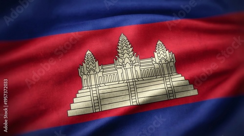 Detailed close up image showcasing the waving texture of the national flag of Cambodia featuring Angkor Wat design.