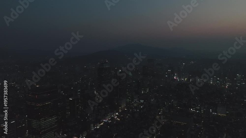 Aerial view of the glowing skyscrapers and busy city lights at night in Teheran-ro, Gangnam, Seoul, South Korea.