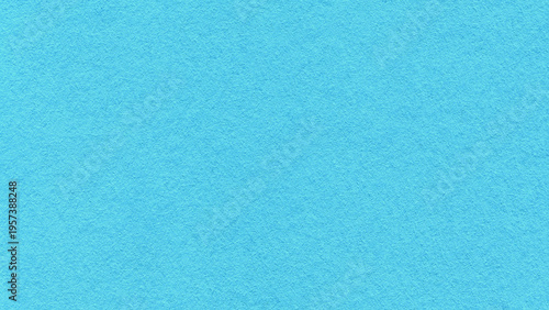 Light turquoise textured paper background with subtle grain surface and soft structure. Pastel blue backdrop, macro