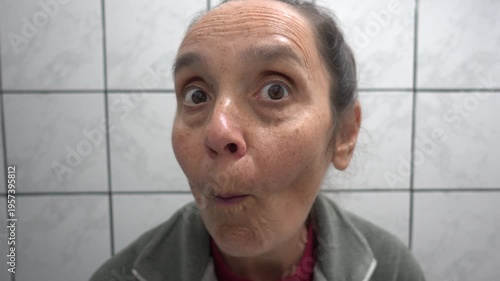 Kas, Turkey - 9 of February 2026: 4K Curious woman peeps in the mirror 
