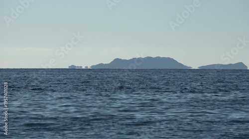 Kas, Turkey - 14 of February 2026: 4K Zoom in Fata Morgana superior mirage of islands over the sea horizon
