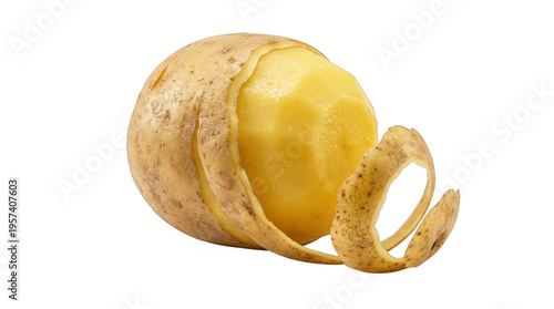 Potato with partially peeled skin on black background