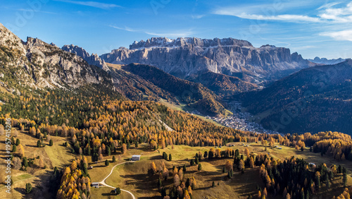 Aerial autumn view of Val Gardena with Sella Group and Selva village