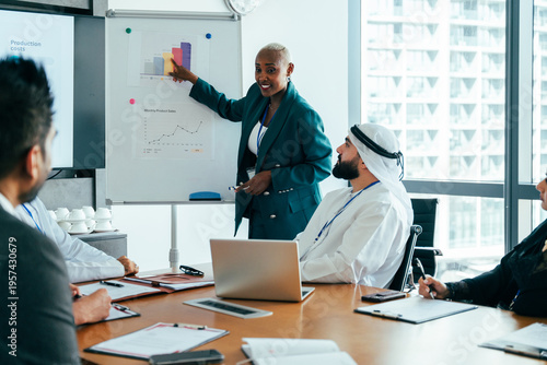 Diverse business team analyzing corporate strategy in office meeting