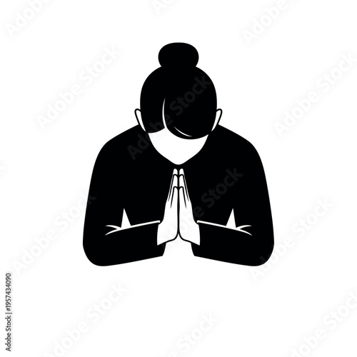 Woman bowing with hands clasped in prayer or greeting gesture.