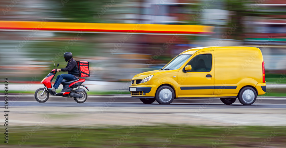 Fototapeta premium Fast delivery of online purchases. A van and a courier on a scooter race through city traffic to their destination. Panning and motion blur