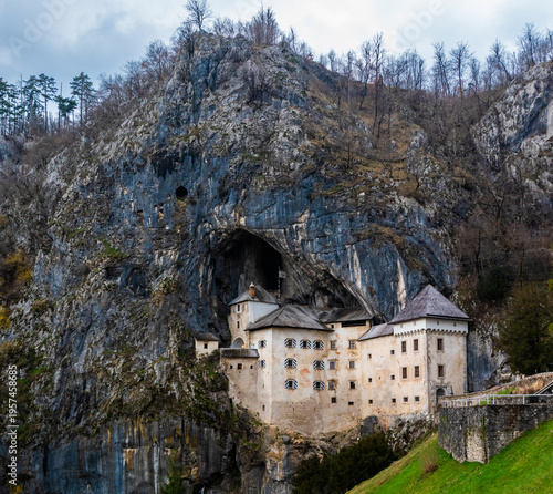 Predjama Castle built into cliff in Slovenia with dramatic cave entrance and historic architecture
