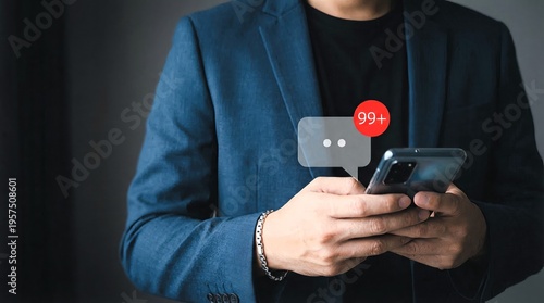 Businessman holding a smartphone displaying an overwhelming amount of unread social media notifications or text messages
