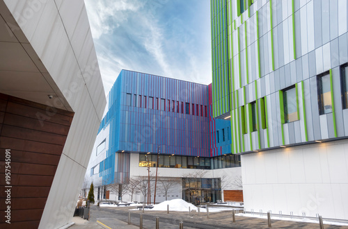 Architectural use of vertical metal siding in different colours and planes on institutional building facades, nobody