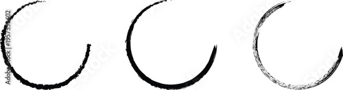 Three black fishing hooks on a white background varying in size and detail