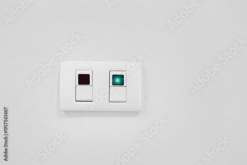Modern Light Switch with Indicator on White Wall Background