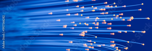 Abstract Fiber Optics: Glowing BlAbstract Fiber Optics: Glowing Blue Data Streams and Digital Networks. Selective focus