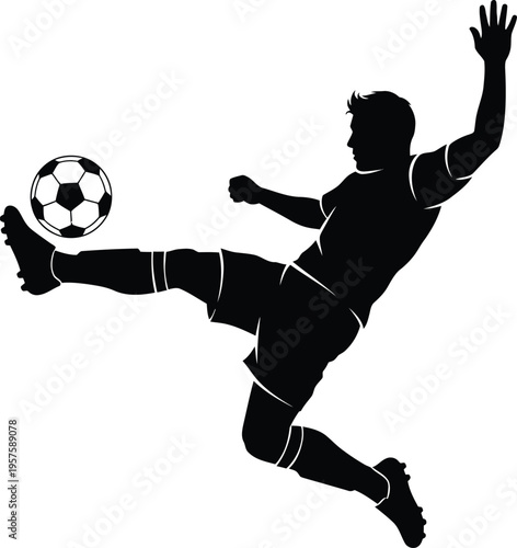 Silhouette of a man kicking a soccer ball with one leg in mid air motion