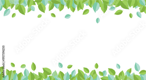 Fresh green and blue leaves forming a natural frame on white background