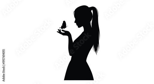 Woman gazing at a butterfly with outstretched hand a dark silhouette