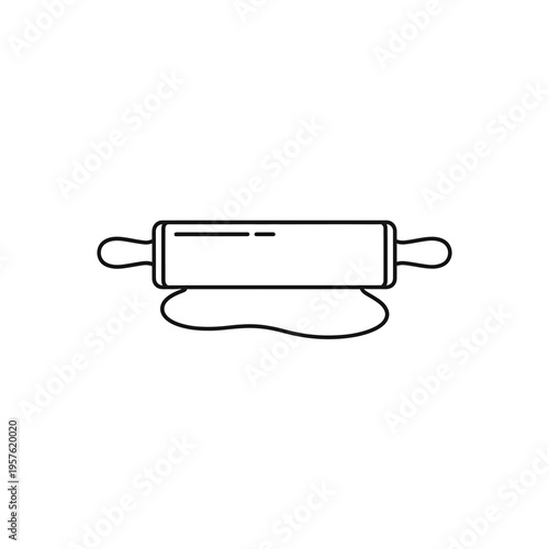 A rolling pin on dough