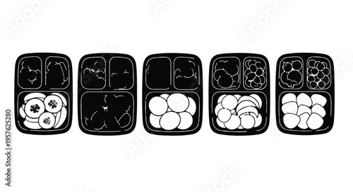 Healthy meal prep containers with various food portions in black plastic trays for diet and nutrition planning