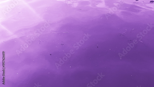 Murky purple water surface with ripples