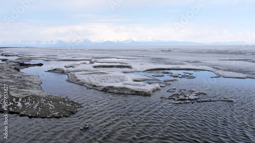 The icy shore of Lake Baikal in Russian Siberia in late spring. The northernmost point of Lake Baikal is located in the small town of Nizhneangarsk.