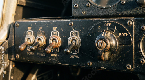 Vintage aviation toggle switches and magneto rotary switch on instrument panel