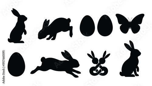 Black silhouettes of rabbits butterflies and eggs arranged on a white background