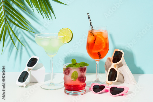Margarita, Aperol Spritz and strawberry mojito at blue background.