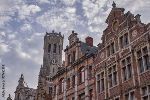 Photos View of the Belfry of Bruges tower behind historic brick facades - Bruges, Belgi