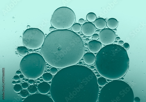 Obraz na plátně Abstract blue green oil bubbles in water, macro liquid background